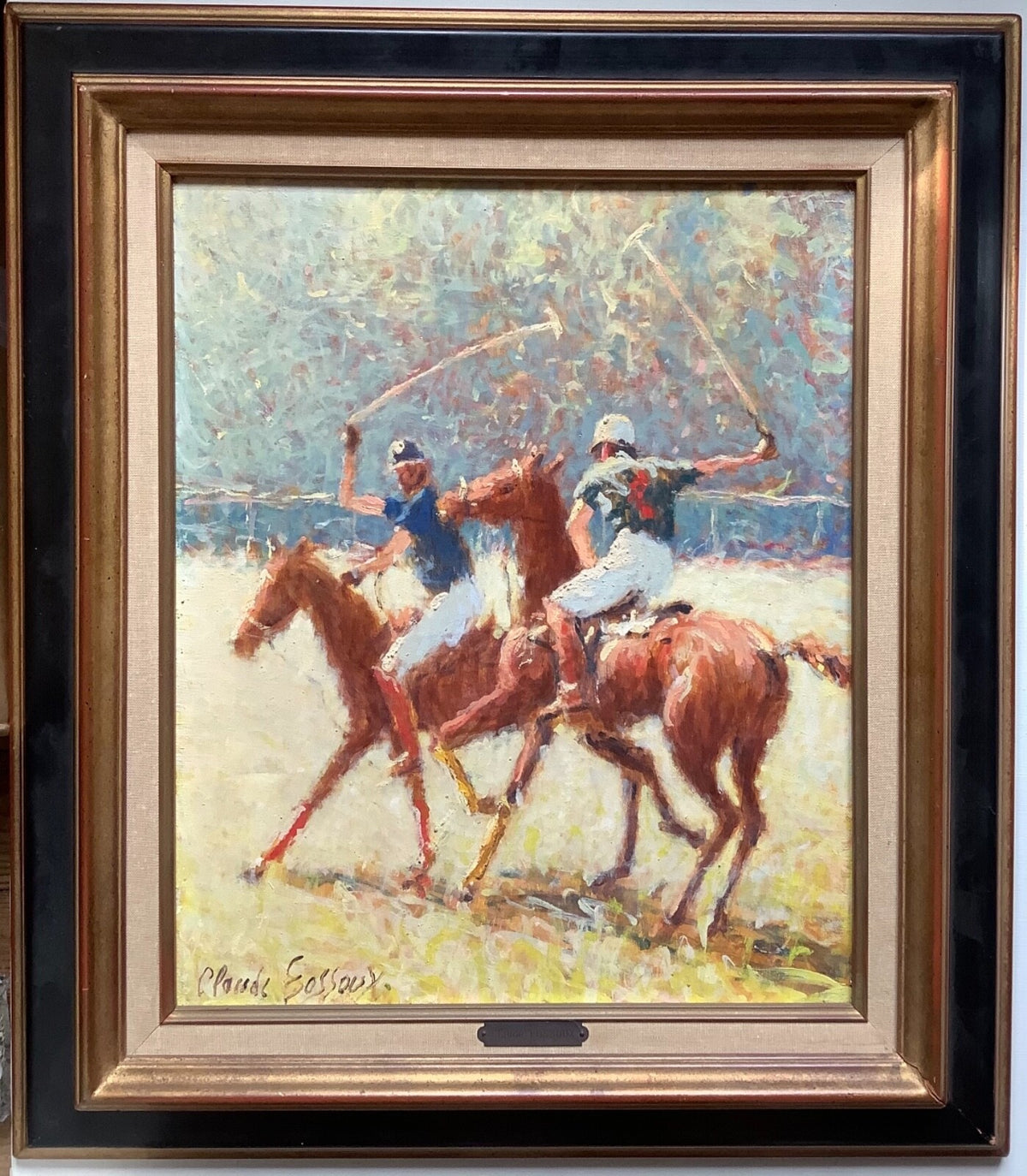 Two polo players at the gallop with mallets raised, their chestnut ponies crossing a sunlit field, in a gilt and black frame (Claude Fossoux)