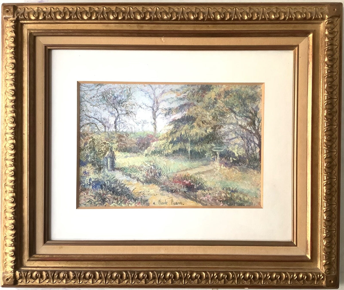 Signed pastel by Hugues Claude Pissarro showing a garden path leading to a stone birdbath, in a moulded gilt frame under glass