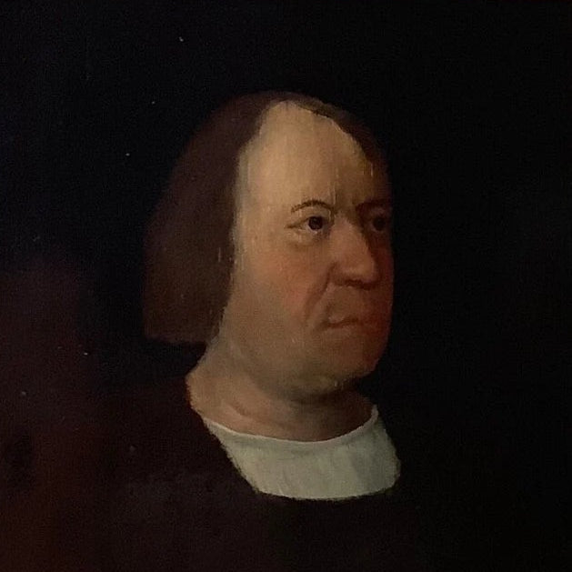 Small antique portrait of a man in a white collar, oil on panel in a gilt frame