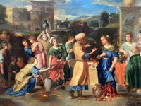 The frieze of figures across the foreground, women kneeling and standing with jars as Eliezer presents the gold ring to Rebecca
