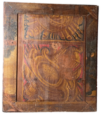 Painted reverse of the panel with yellow scrollwork and red highlights on a pegged corner-braced structure