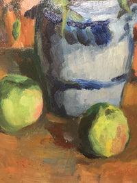 Close view of the blue and grey stoneware jug with its cobalt bands laid in single strokes, and two green apples modelled in three tones of paint