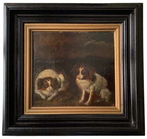 Two King Charles spaniels in a dark landscape, 18th century French oil on panel in an ebonized frame