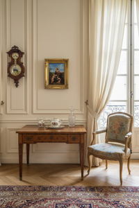 Antique painting after Raphael of the Madonna and Child displayed in a French sitting room