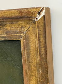 Open mitre at the upper right corner with gesso losses and the red bole showing through the worn gilding