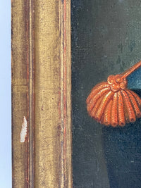 Water gilded moulding with the red bole showing along the edges, beside the raised bullion of the epaulette