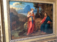The panel seen at an angle, showing the depth of the carved gilt mouldings around the picture