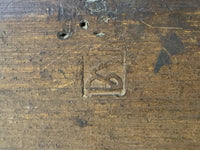 Panel maker's mark struck into the back of the oak board, with old worm holes above (Samaritan woman panel)