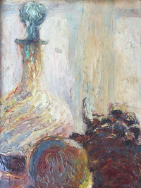 Close view of the carafe with its blue-green stopper and the mass of grapes, the paint built in thick circling strokes