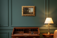 19th century Barbizon river landscape in a gilt frame above a writing desk in a green study