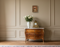 The small framed panel on a pale wall above a chest of drawers, no wider than the drawer front