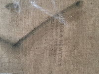 Colourman's stamp printed vertically on the raw canvas at the reverse