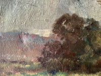 Macro of the sky scraped thin over the canvas weave, with red roofs on the far hillside