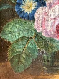 Detail of the leaves and blooms at the left of the bouquet, lit from the left against the dark ground