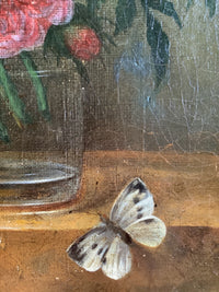 Detail of the glass of water on the stone ledge with the white butterfly settled beside it