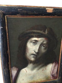 Angled view of the Ecce Homo showing the ebonised frame with its gilt sight edge and the losses along the upper rail