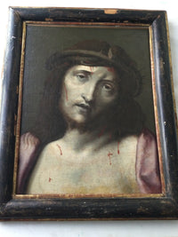 The Ecce Homo in its full antique ebonised frame, the gilt fillet worn to the bole around the sight edge and the black mouldings rubbed on every side