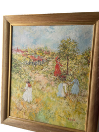 Seen at an angle, the reeded gilt frame and the ridges of paint catching the side light