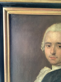 The framed portrait seen at an angle, showing the depth of the gilt moulding