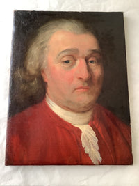 The unframed canvas seen from above at a slight angle, the raking light picking up the relief of the paint surface and the slack of the canvas across the lower half, with the painted edge turning over the tacking margin on the left