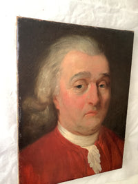 The unframed canvas seen in three quarter view, the sitter in a red coat and powdered wig against a dark ground, with the tacking edges and the shallow depth of the stretcher visible along the left and lower sides