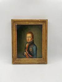 Angled view of the framed portrait showing the depth of the gilt moulding and the crazed water gilding over red bole along the outer edge