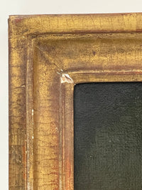 Macro of the inner corner showing the water gilding burnished over red bole, its fine crazing, and a single loss to the gesso at the angle