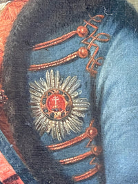 Macro of the breast star, silver rays around a red medallion charged with the white patriarchal cross of Hungary beneath a crown, the insignia of the Order of Saint Stephen