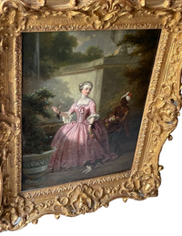 Oblique view from the lower left showing the pierced Rococo carving standing clear of the frame and the painting set deep within it
