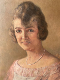 Macro of the face showing the green eyes cut in against dry blended skin and the pearls painted one by one, each with its own point of light