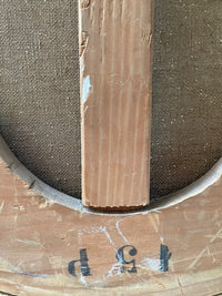 Macro of the stretcher bar stamped with the French trade format 15 P, matching the sixty five by fifty centimetre size of the oval canvas