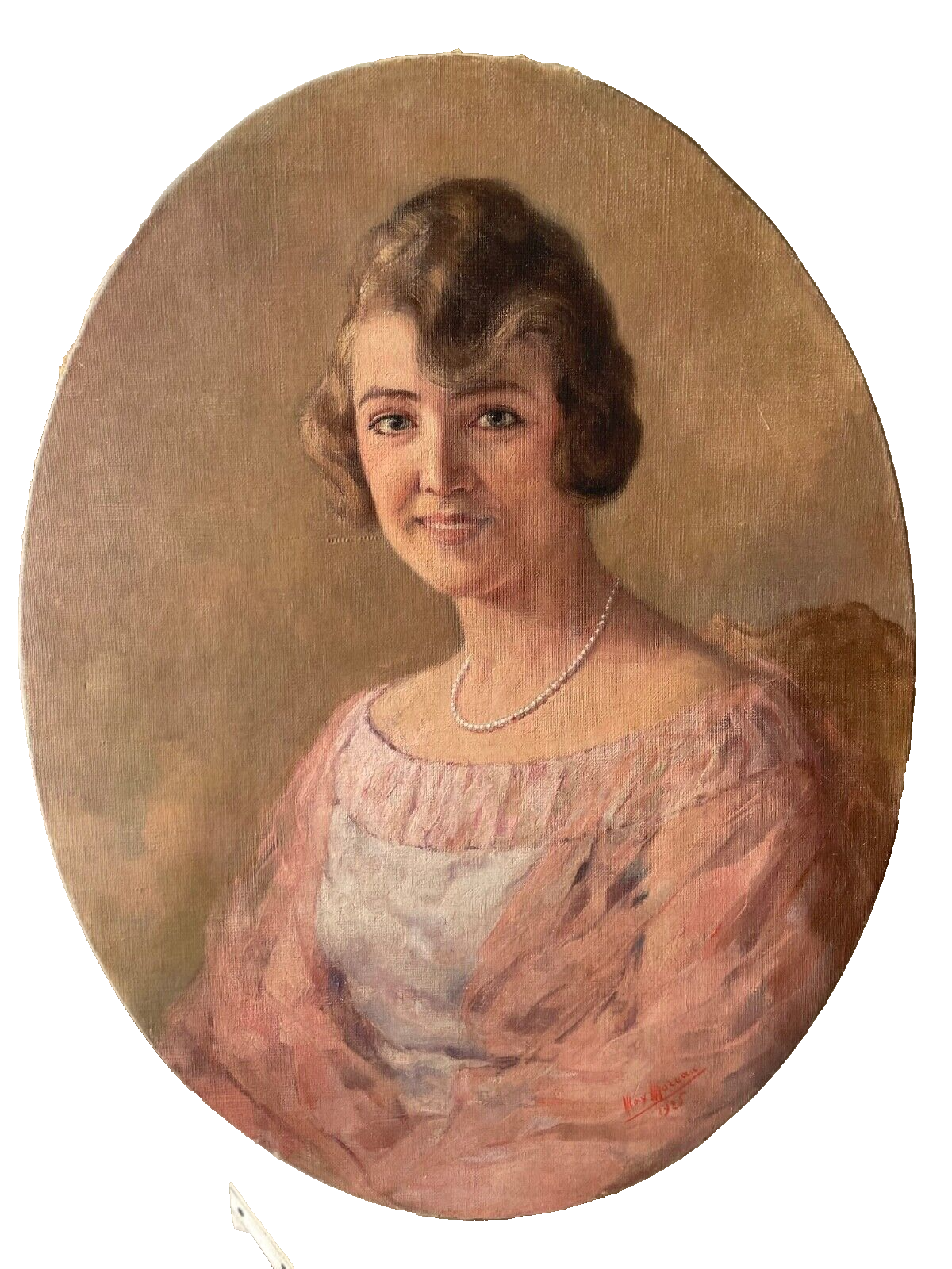 Signed oval portrait of a young woman in a rose gown with a short strand of pearls, dated 1925, unframed oil on canvas by Max Moreau
