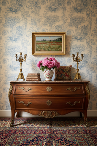 Signed 19th century poppy field landscape by Rousseau in a gilt frame above a commode in an elegant French interior