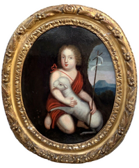 Seventeenth century French oil of Saint John the Baptist as a child holding the lamb and the reed cross, in a carved oval giltwood frame
