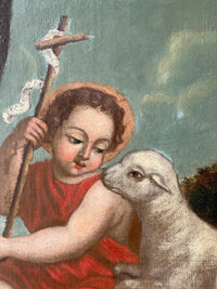Macro of the reed cross with its lettered scroll and the halo, the sheep pressed against the child's shoulder