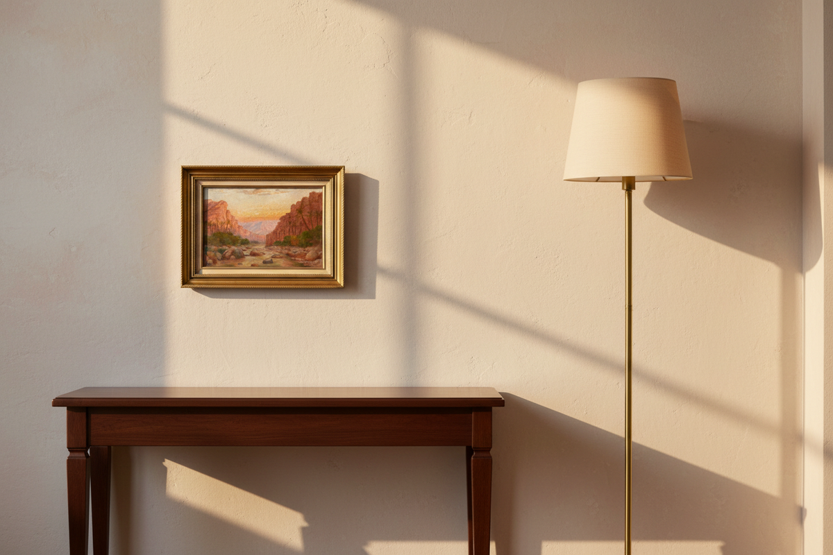 Small signed orientalist oil painting of a palm oasis at sunset, hung in a gilded frame above a walnut console in a sitting room (Shonborn oasis)
