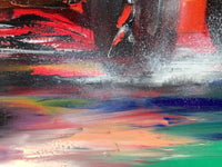 Black, violet, pink, blue and green dragged sideways across the wet track