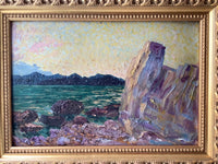 Seen from the left, the carved gilt moulding and the raised paint of the cliff catching the light together