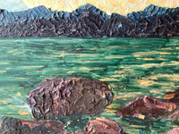 The far headland reduced to one dark blue band, with no detail inside it