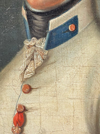 Blue collar, black stock and a small lace jabot at the throat of the white coat