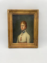 The framed portrait seen whole on a pale ground, the deep cove of the gilt moulding around the canvas