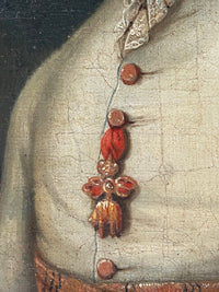 The Golden Fleece on its red ribbon, hanging among the brass buttons of the coat